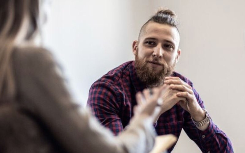 young man in substance use treatment with his therapist