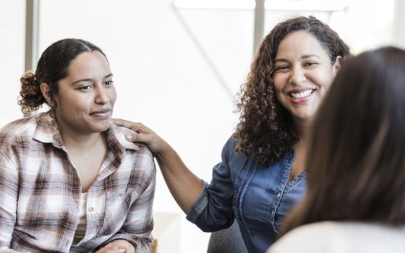 two women in group therapy